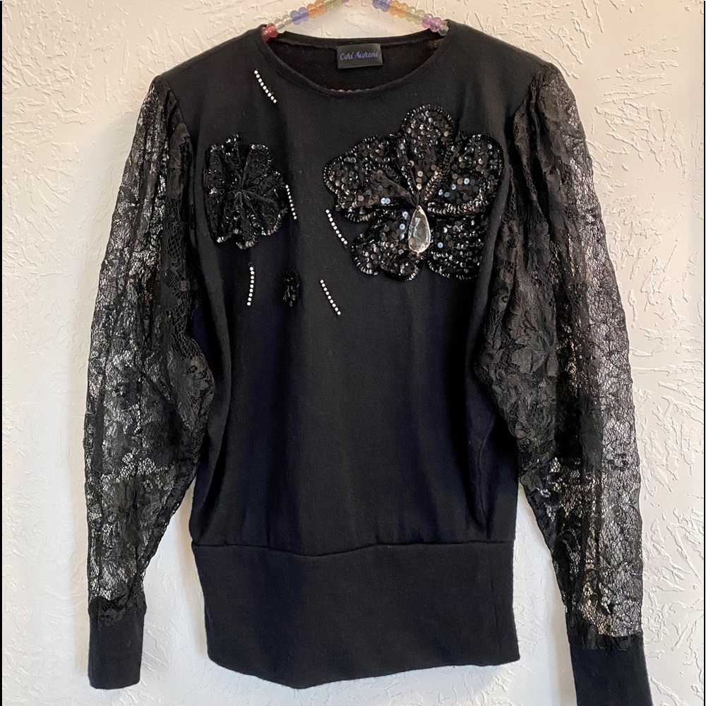 Black top with lace sleeves, sequins, rhinestones!
